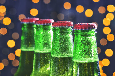 Close-up of multi colored glass bottles on table