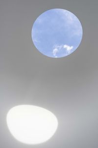 Low angle view of illuminated lamp against sky at night