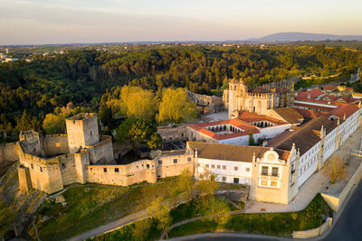 Aerial drone view of convento de cristo christ convent in tomar at sunrise, portugal