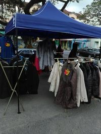 Clothes hanging at market stall