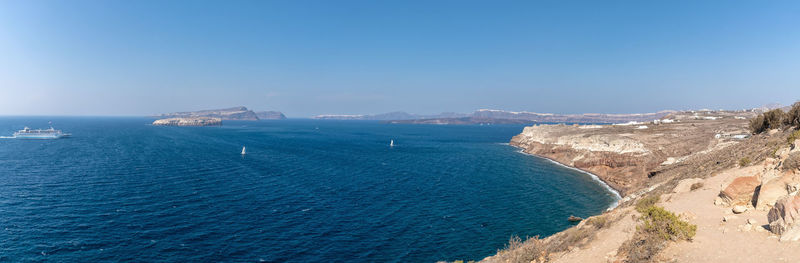 Scenic view of sea against clear blue sky