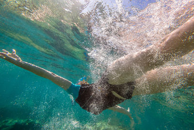 High angle view of man swimming in pool