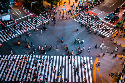 High angle view of people walking on city street