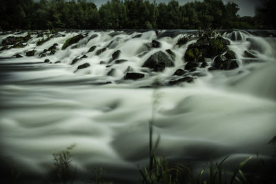 Close-up of water flowing over river