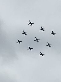 Low angle view of airplane flying in sky