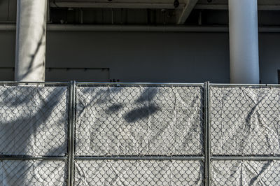 Shadow of railing on wall