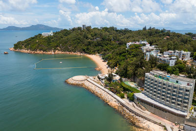 High angle view of swimming pool by sea against sky