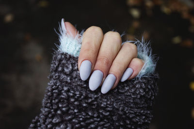 Cropped image of woman hand with nail polish