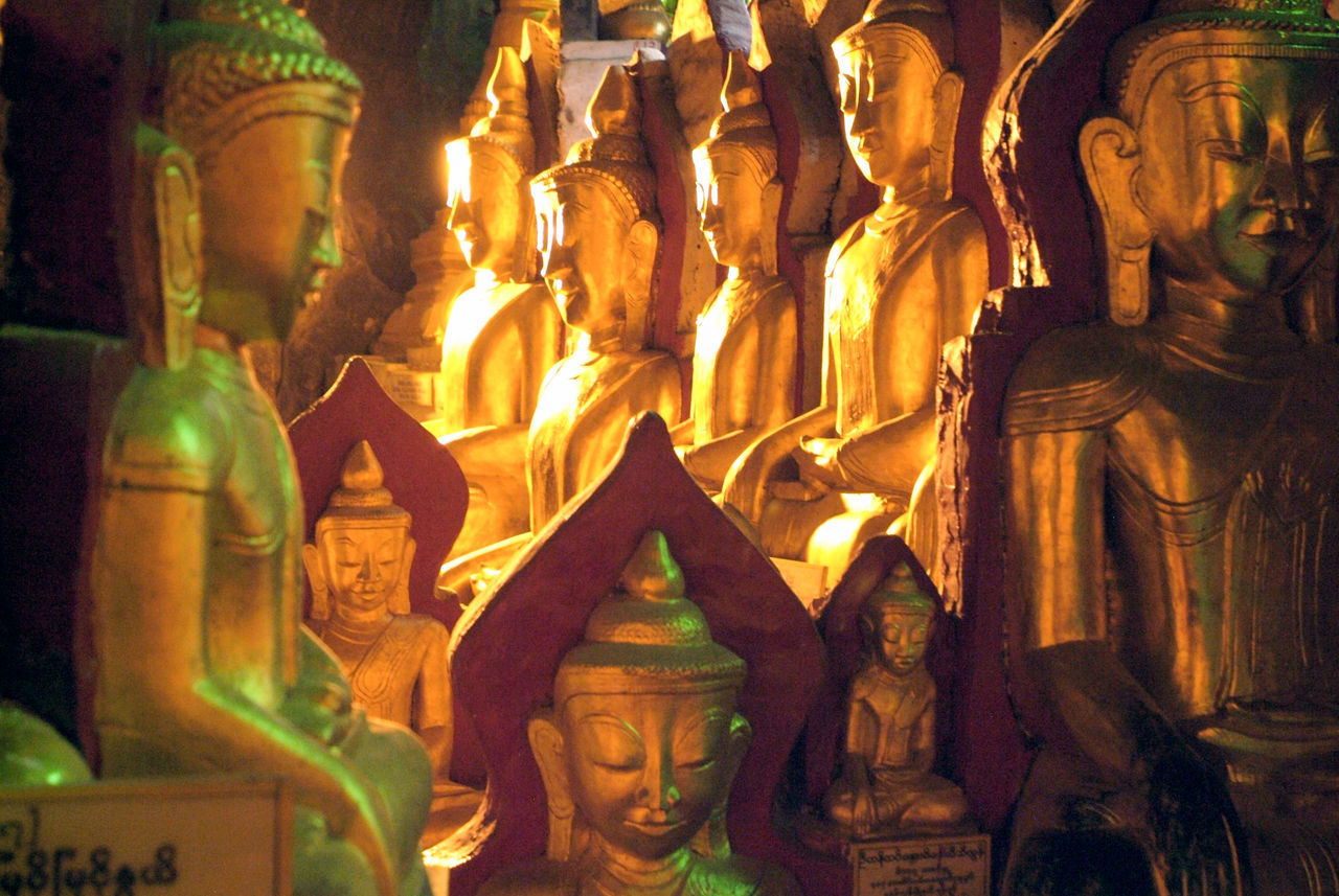 LOW ANGLE VIEW OF BUDDHA STATUES