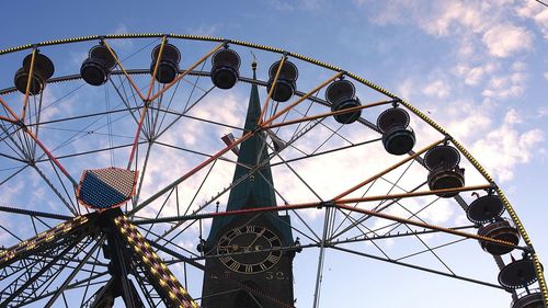 Low angle view of ferris wheel against sky