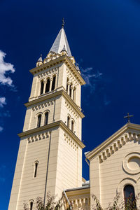 Low angle view of building against blue sky