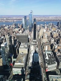 High angle view of modern buildings in city against sky