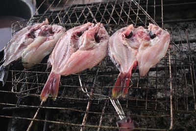 High angle view of meat on barbecue grill