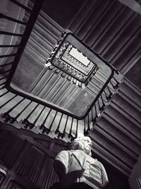 Low section of man on spiral staircase