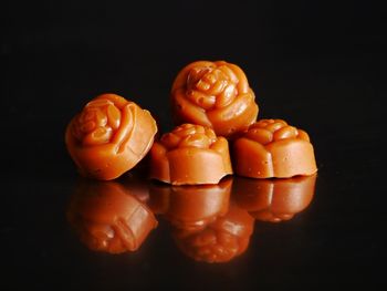 Close-up of pumpkins against black background