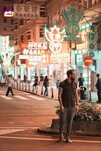 Full length of man walking on city street