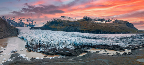 Beautiful glaciers flow through the mountains in iceland.