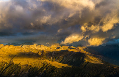 Scenic view of mountains against dramatic sky