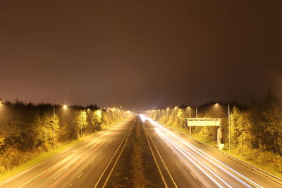 Light trails on road at night