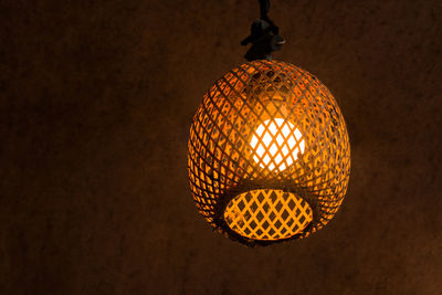 Low angle view of illuminated light bulb