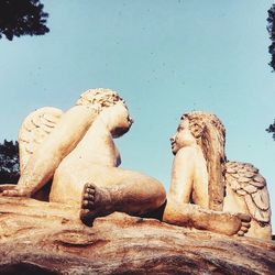 Low angle view of statue against sky