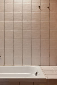 Bathroom tiles and bath close-up