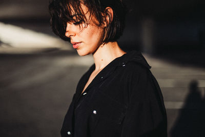 Portrait of young woman looking away