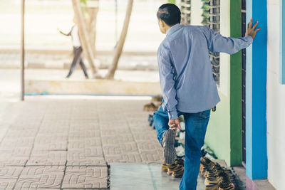 Rear view of man walking outdoors