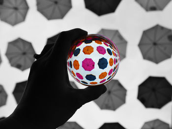Close-up of person holding umbrella