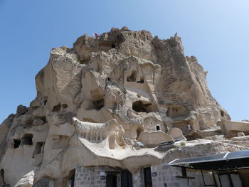 Low angle view of rock formations against clear sky
