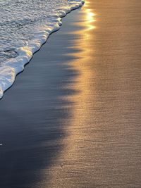 Sunset on the beach with black sand