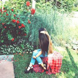 Woman swinging in back yard