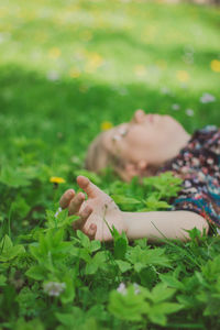 Woman lying down on field