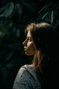 A close up portrait of a woman during sunset