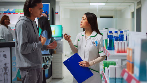 Portrait of doctor examining x-ray in office