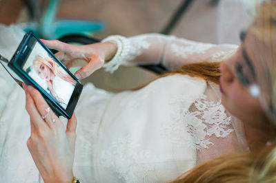 High angle view of woman using phone