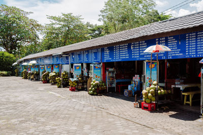 Street market by building in city