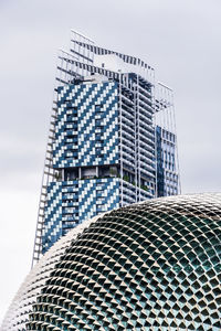 Low angle view of modern building against sky