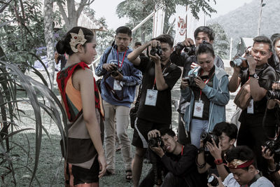 Group of people photographing outdoors