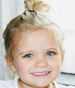 Close-up portrait of smiling girl