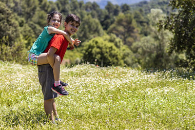 Full length of boy standing on grass