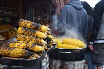 Close-up of roasted corns at food stall