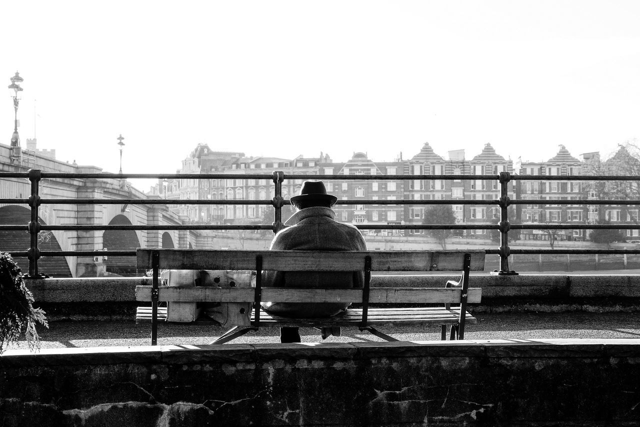 railing, clear sky, rear view, one person, real people, outdoors, men, sky, day, bridge - man made structure, stadium, adults only, one man only, only men, adult, people, architecture