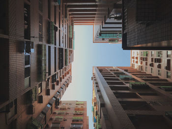 Low angle view of buildings in city against sky