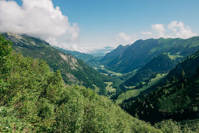 Scenic view of mountains against sky down into kleinwalsertal