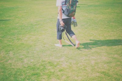 Man standing on grassy field