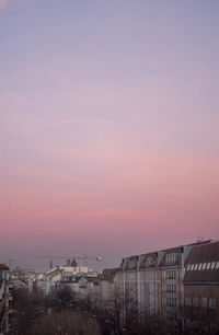 Buildings against sky during sunset