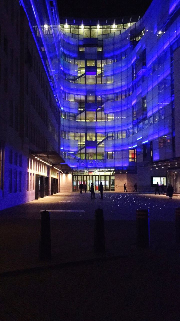 illuminated, architecture, built structure, night, building exterior, blue, city, modern, indoors, building, transportation, city life, lighting equipment, light - natural phenomenon, office building, glass - material, incidental people, dark, window, street