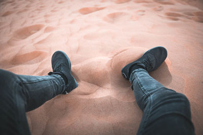 Point of view about legs in the sand