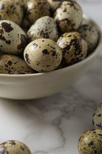 Quail eggs on a marble table.